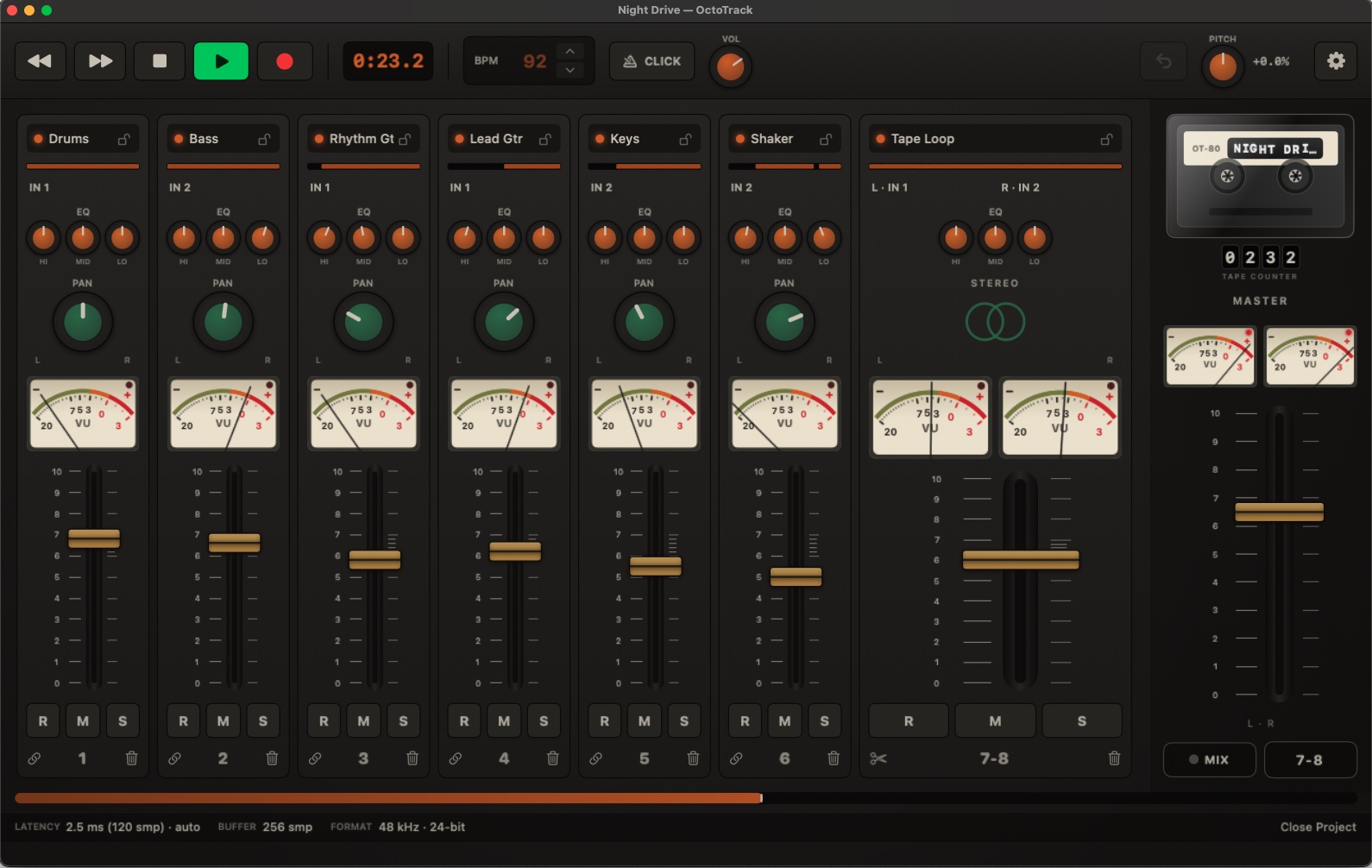 OctoTrack Studio main window: eight channel strips with VU needles moving, amber EQ knobs, a wide stereo pair on tracks 7-8, cassette reels turning and the transport rolling at 0:24.